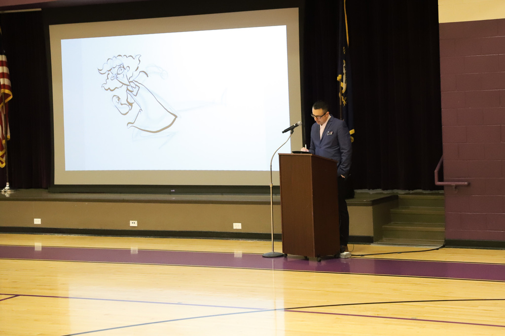 Jarrett J. Krosoczka draws for students at Dishman McGinnis Elementary