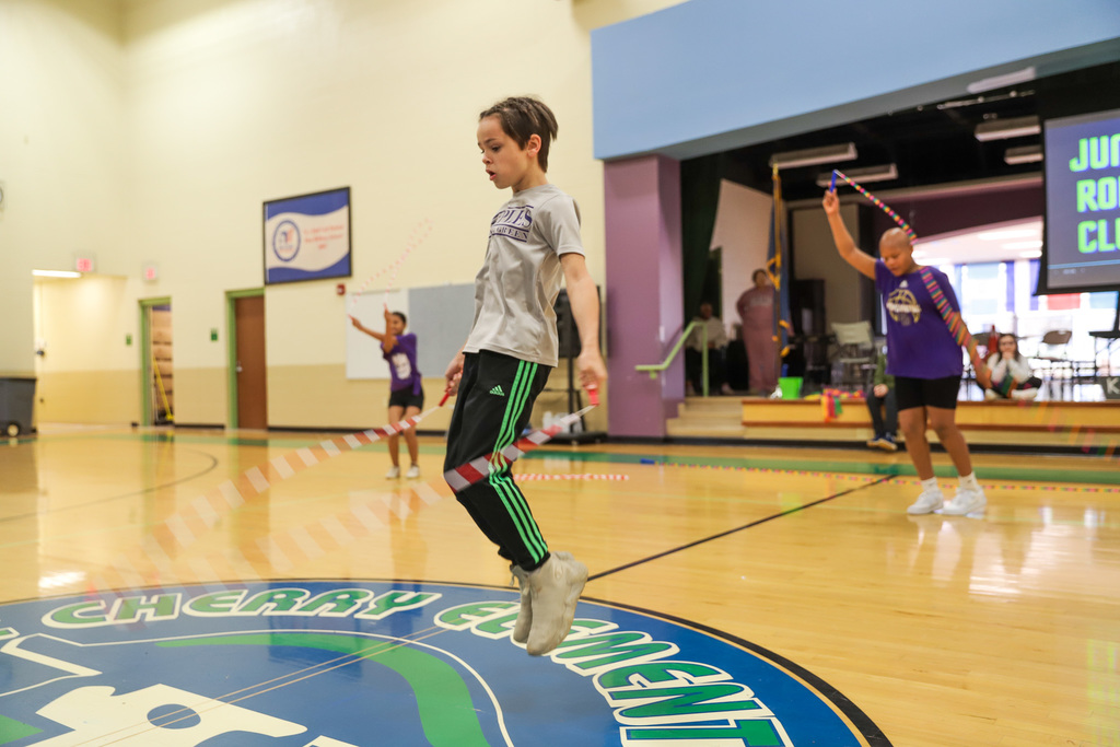 T. C. Cherry Jump Rope Club: One student jumping in foreground two in background