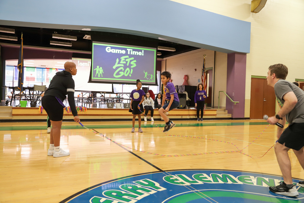 T. C. Cherry Jump Rope Club: One student jumping two holding ropes