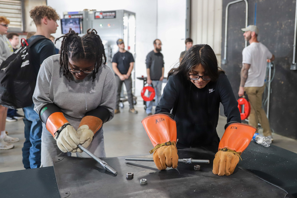 Two students compete in the Nuts and Bolts Challenge at M&L Electrical