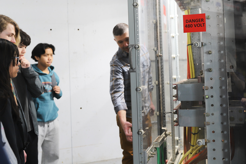 Students learning about an electrical unit at M&L
