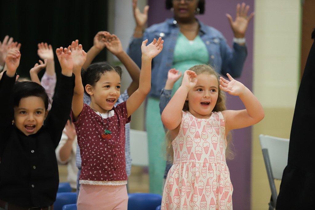 Preschool students singing at PreK Promotion
