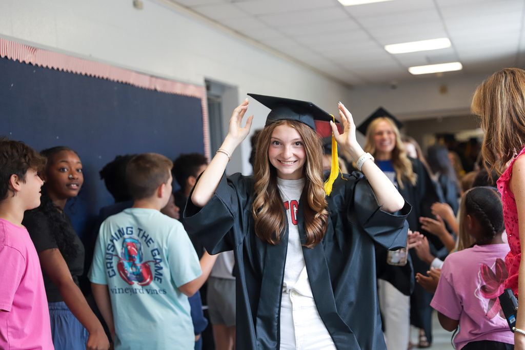 Grad Walk McNeill adjusting cap