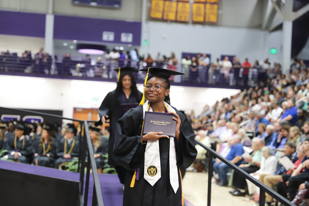 Grad with diploma