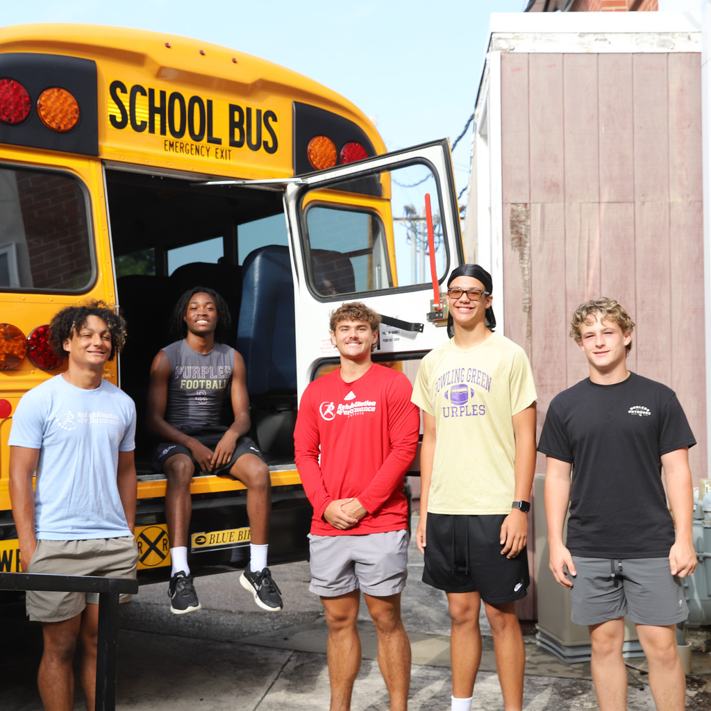 BGHS football helping unload the bus