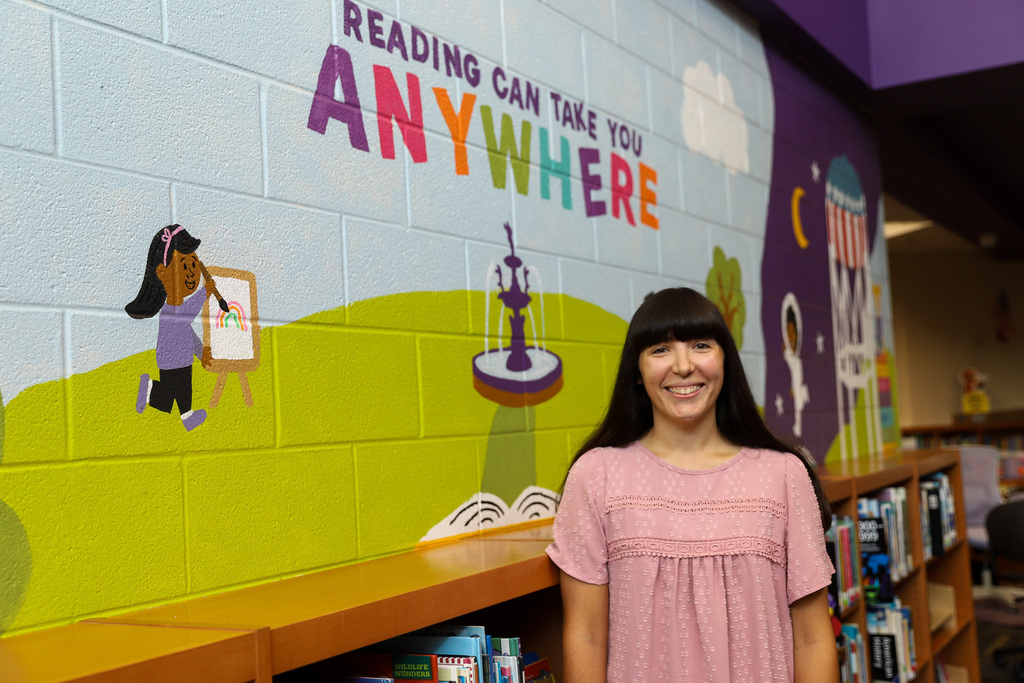 Ashley Scott in front of mural at PBC
