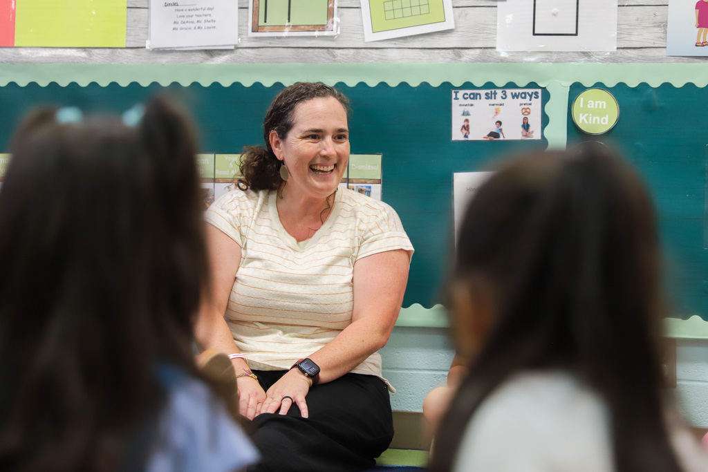 Ms. Roberts smiling at students