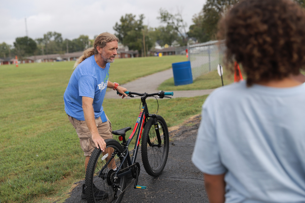 BikeWalkBG teaching students how to check bikes before riding.