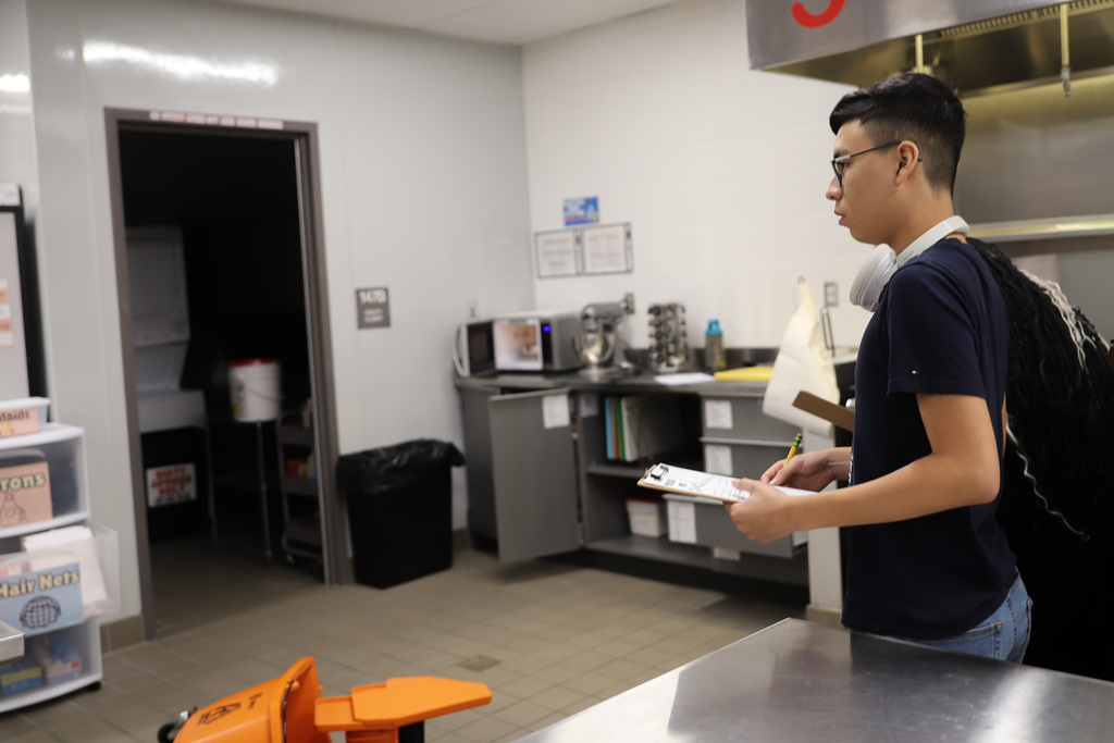 Students look at Kitchen Crime Scene in Culinary I