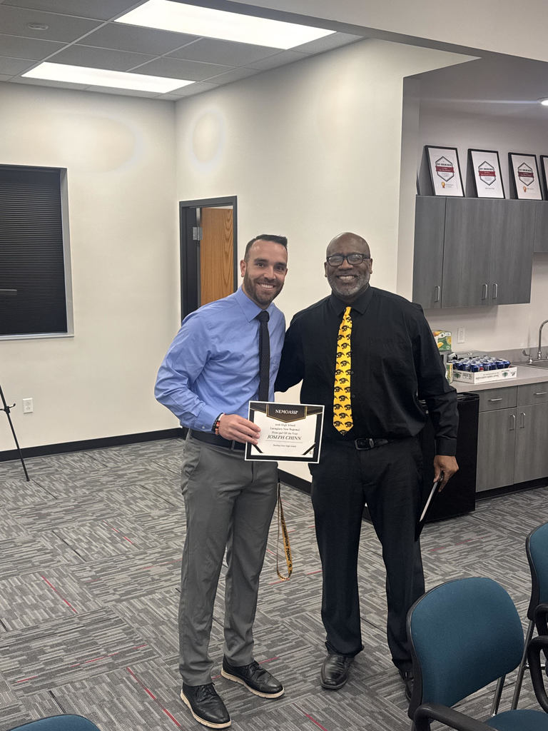 Joe Chinn accepting award from representative.