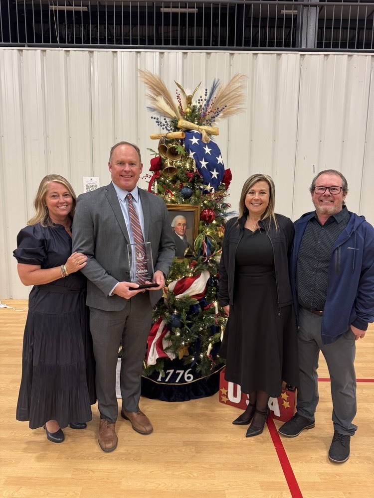 hogan construction in front of a Christmas tree