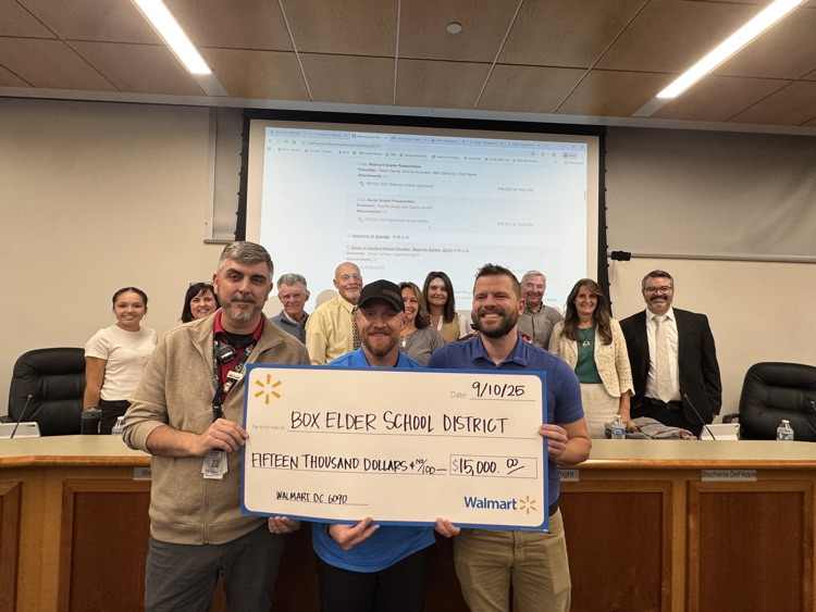 Walmart presents check to board