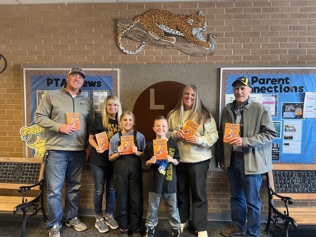 Students and teacher with books