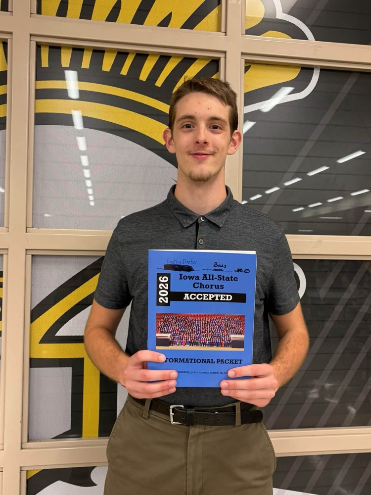 A student holding an Allstate music folder