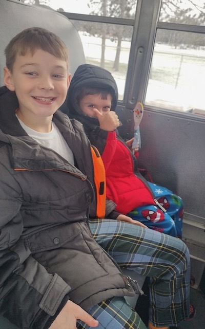 Kindergarten & 4th Grade Deliver Christmas crafts around town