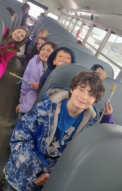 Kindergarten & 4th Grade Deliver Christmas crafts around town