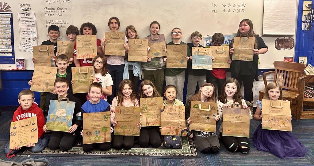 4th Grade Classes pose with their earth day poems