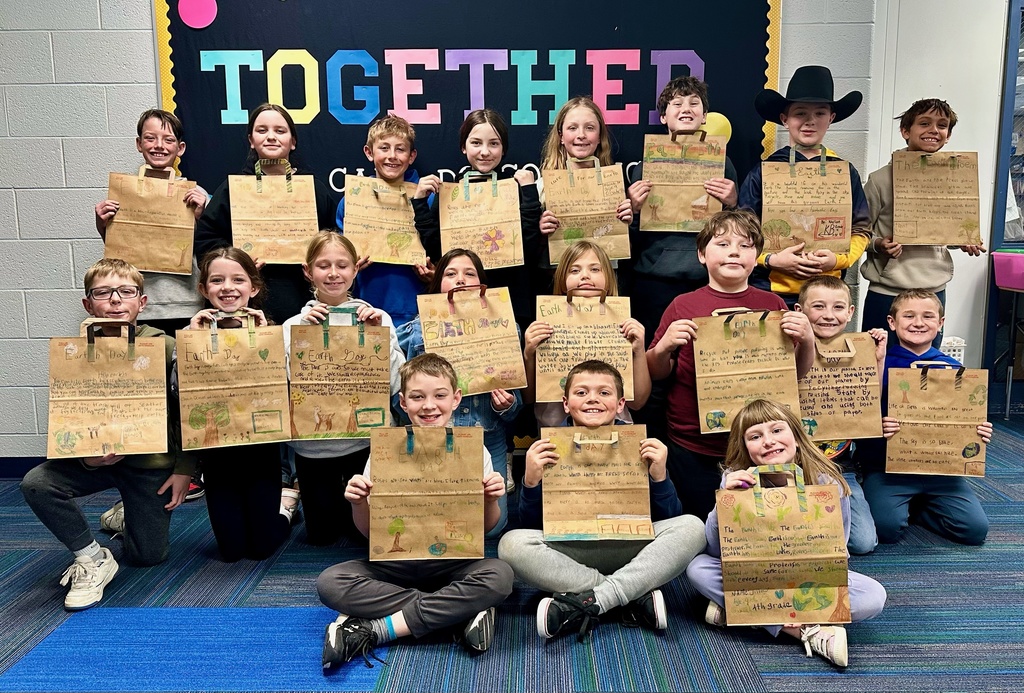 4th Grade Classes pose with their earth day poems