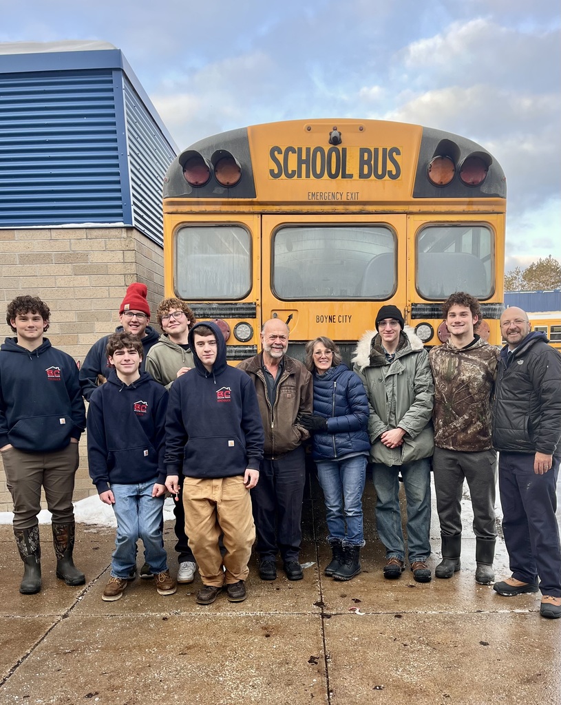 Building Trades Students help to load the bus  for Community Christmas