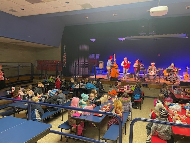 Dollar in the Juke Box band plays for students at lunch