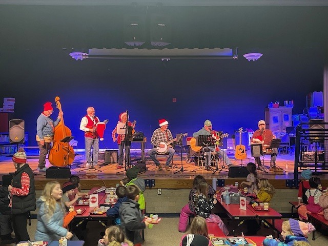Dollar in the Juke Box band plays for students at lunch