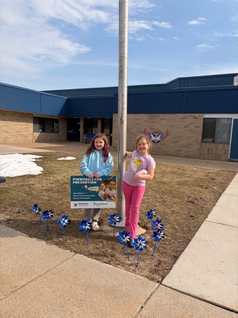 Students put up pinwheel garden for child abuse prevention month