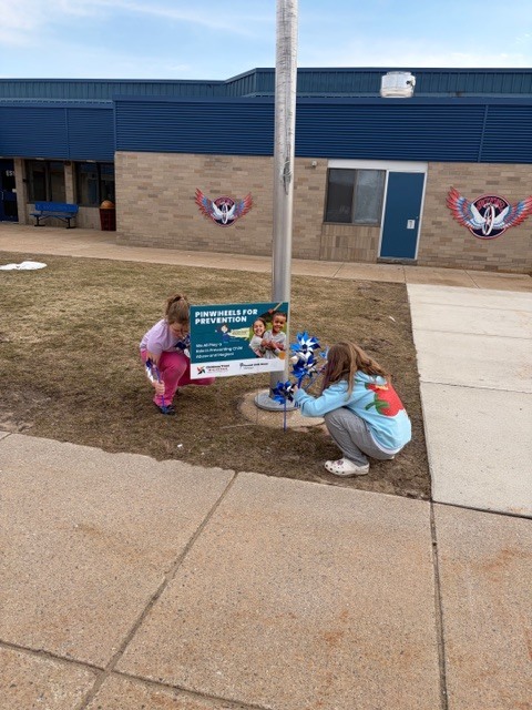 Students put up pinwheel garden for child abuse prevention month
