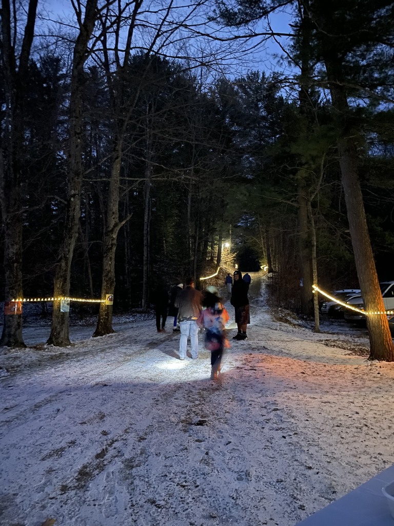 rope lines line a snow-covered trail for the literacy walk