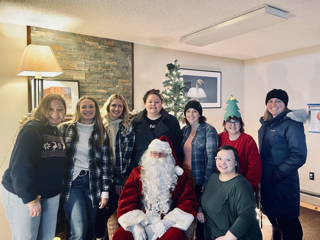 Early Learners Program staff pose with Santa