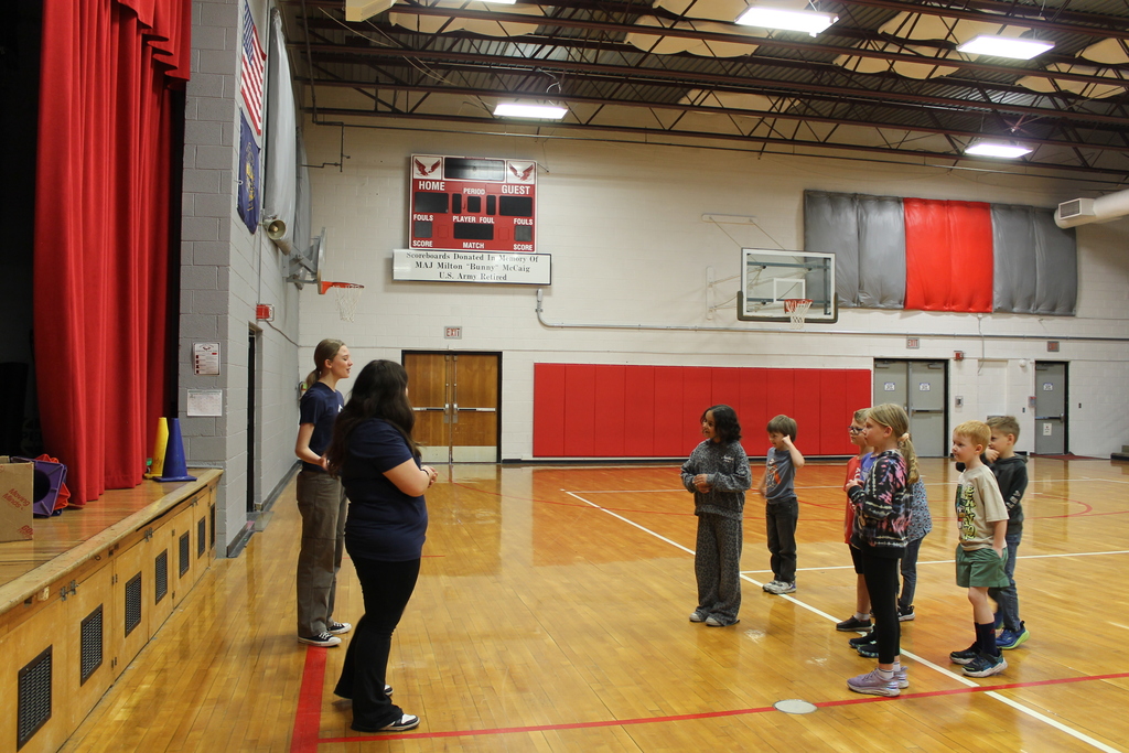teaching students in gym 
