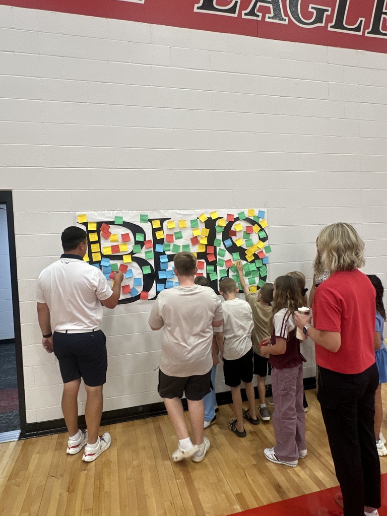 putting sticky notes on poster