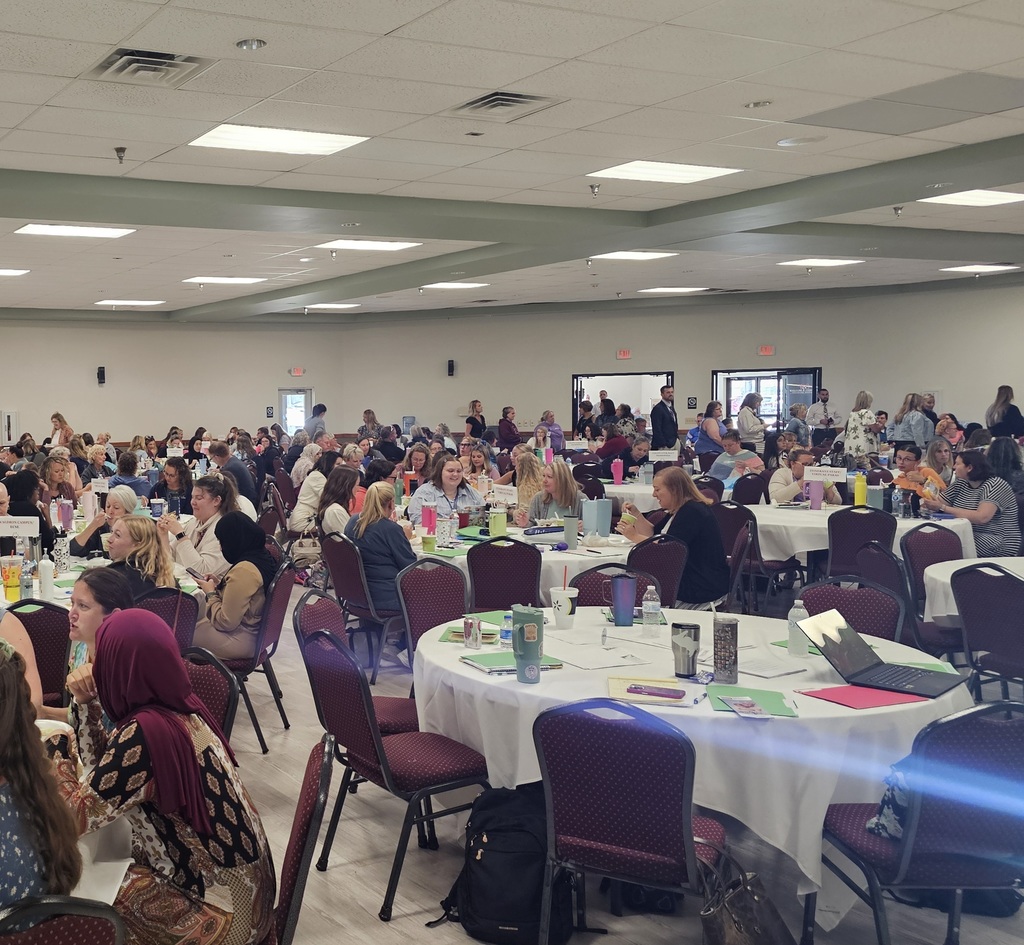 BISD Staff sitting at tables in Dearth Center