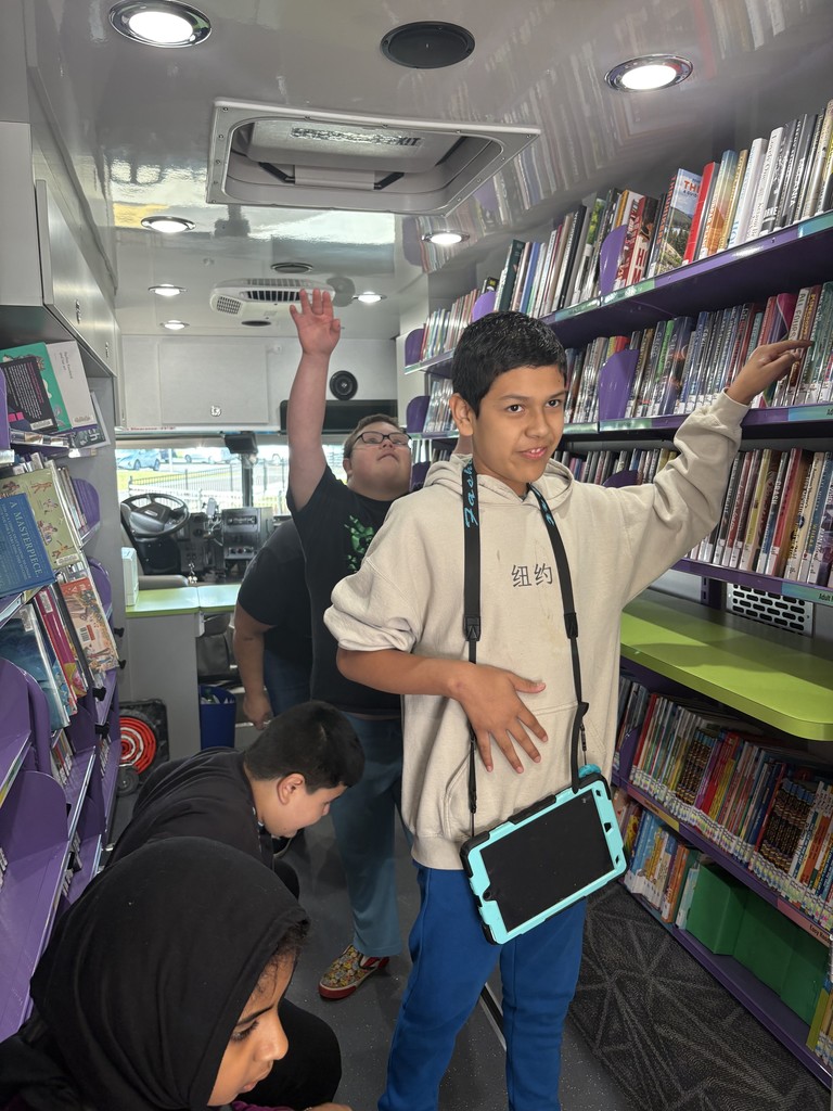 Students from Mrs. George's class choosing books.
