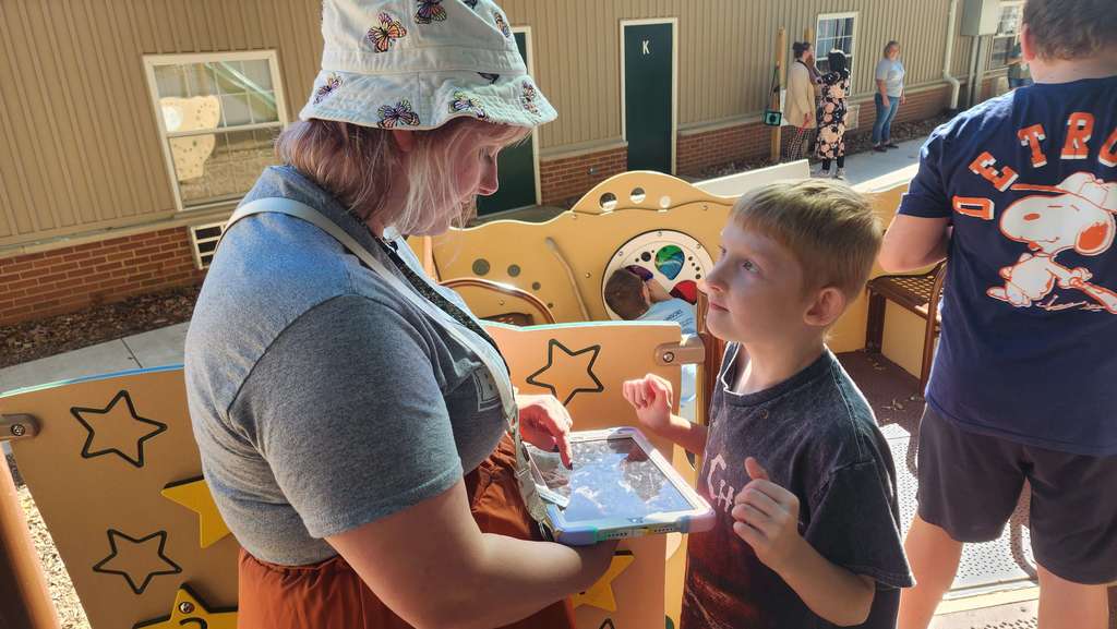A student using his IPad to communicate with his teacher.