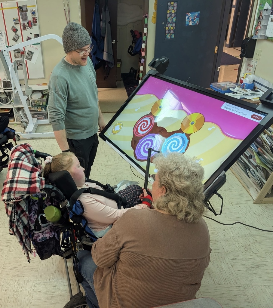 Waldron student using her 3D printed stylus on the classroom smart TV.