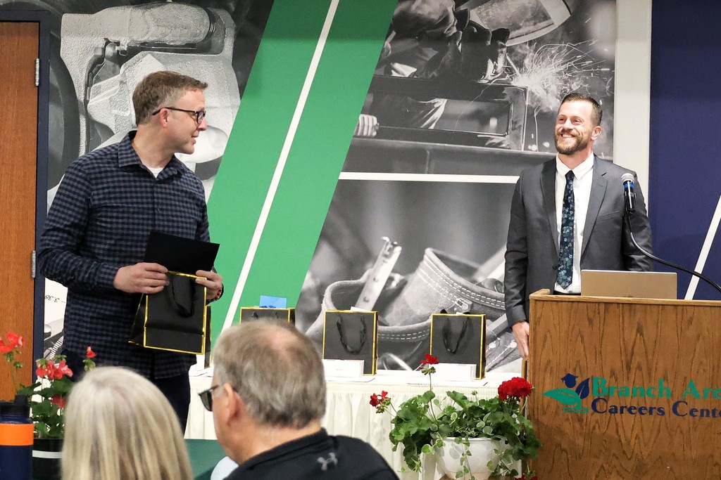 QMS Principal Brandon Suever accepts his award.