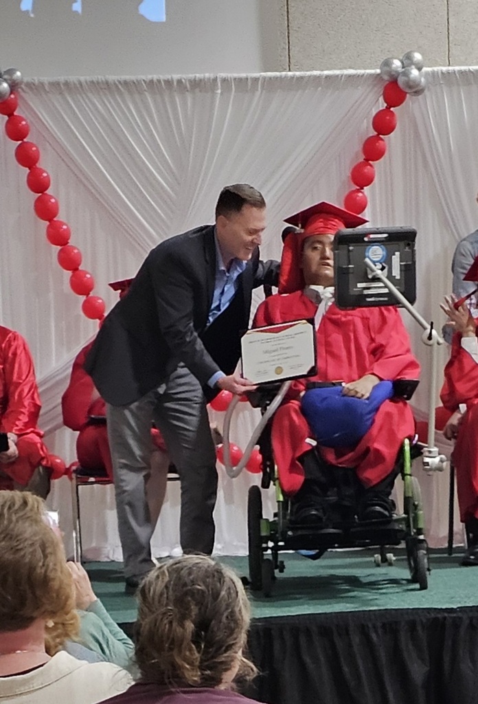 Superintendent, Darrin Adair presenting diplomas