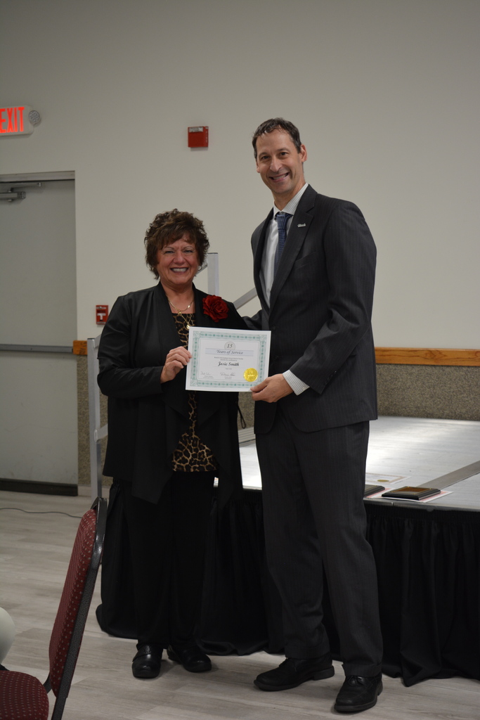 Photo of Josie Smith Receiving a certificate from Dustin Scharer 