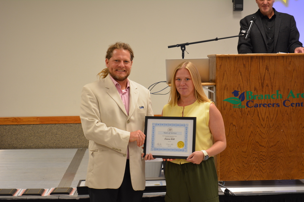 Staff Member and Director holding certificate