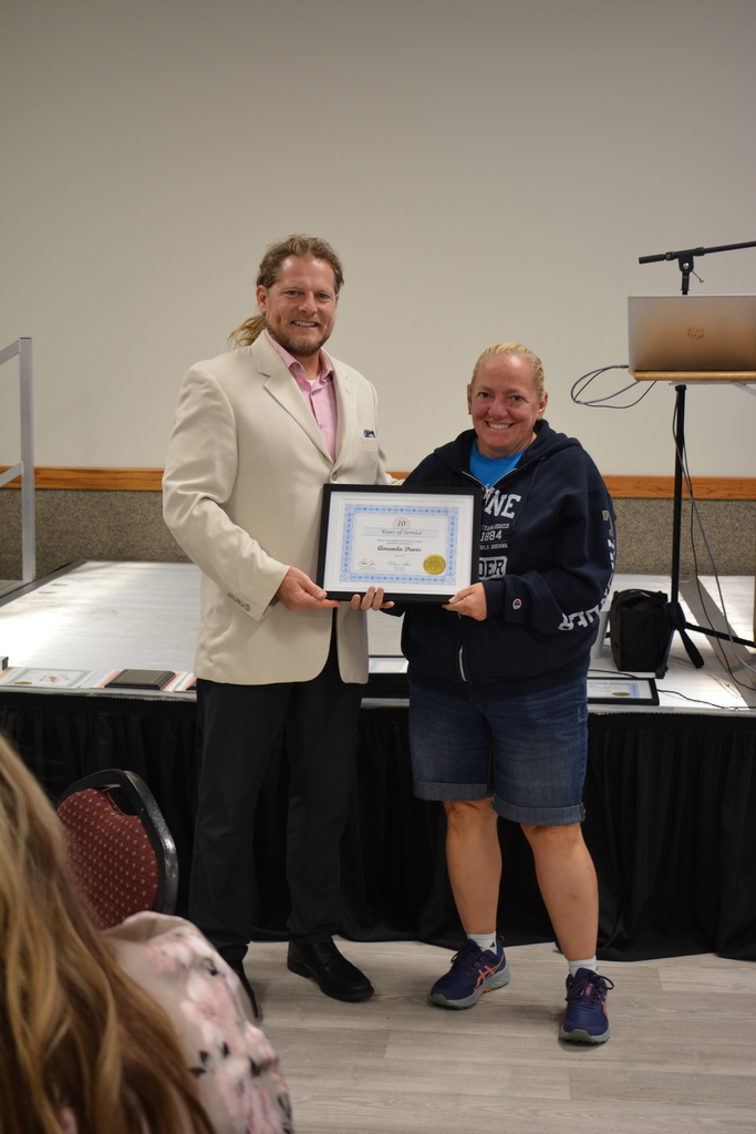 Staff Member and Director holding certificate