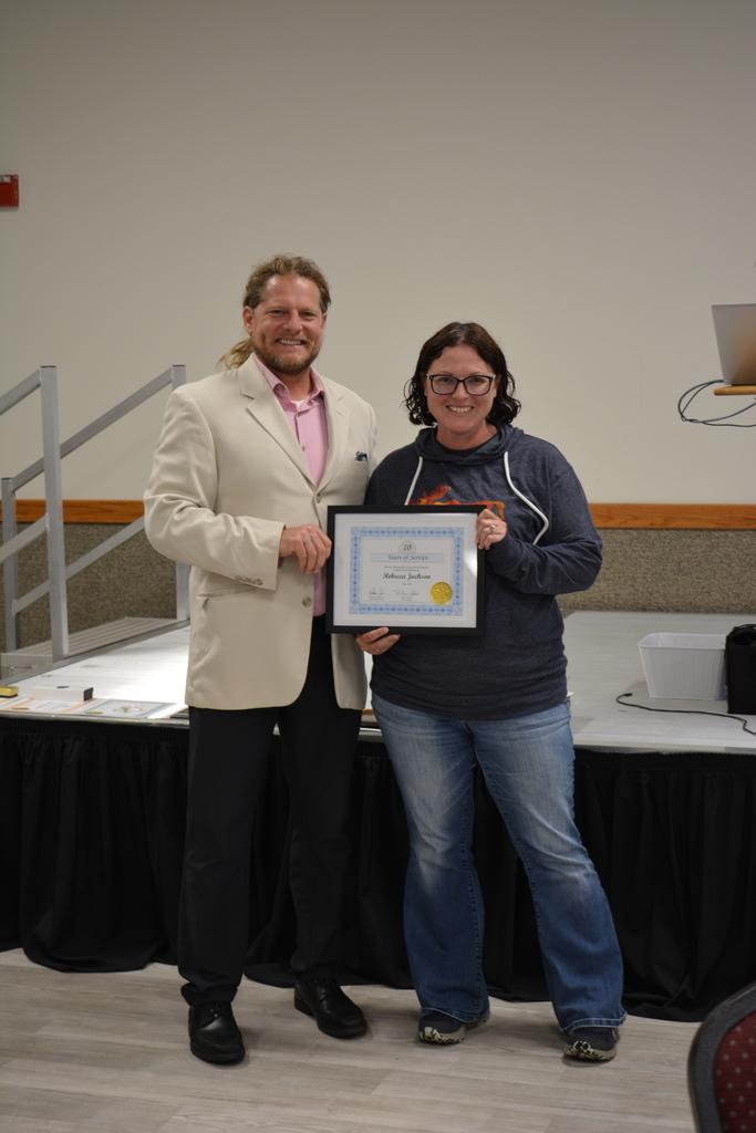 Staff Member and Director holding certificate