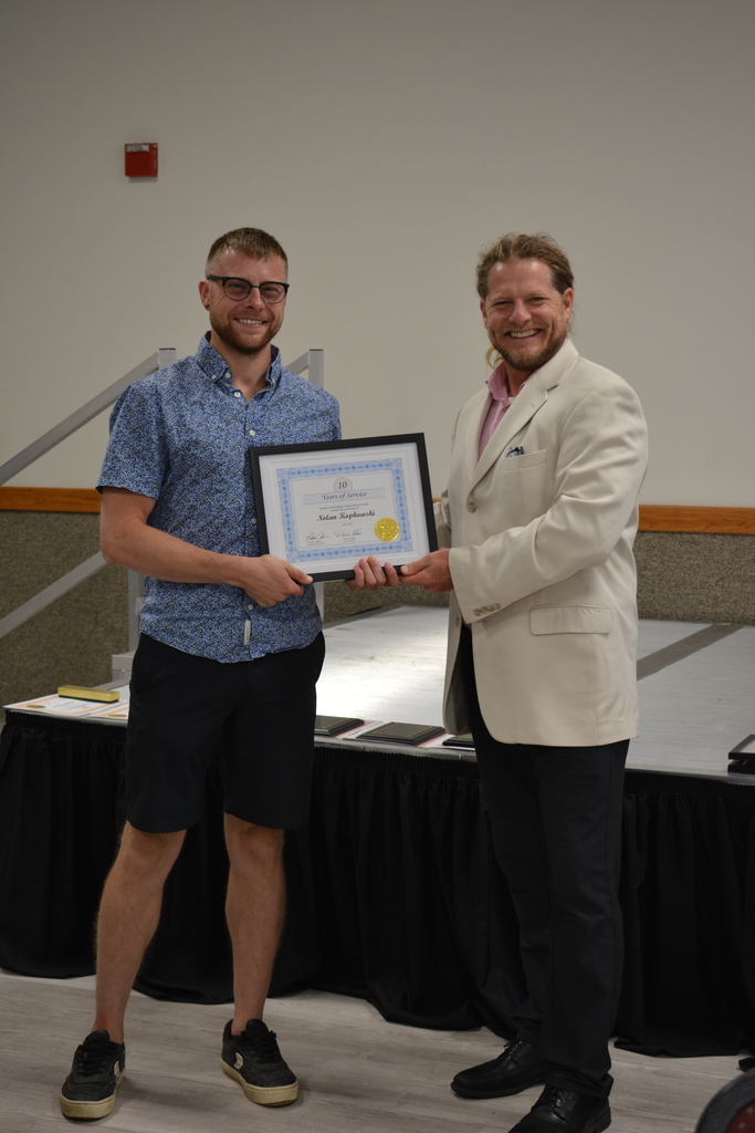 Staff Member and Director holding certificate