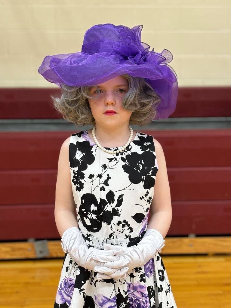little girl dressed as old fashioned woman