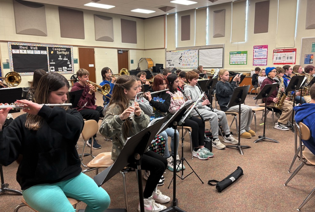 flute players in band playing instruments