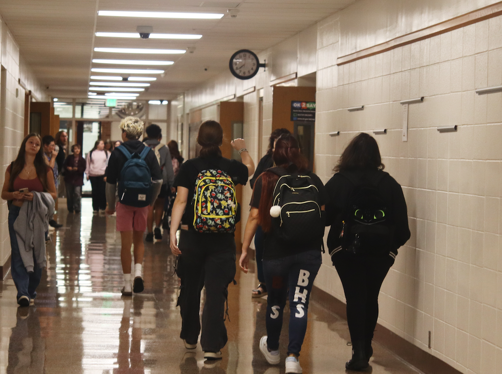 group of kids walking in the school hallways