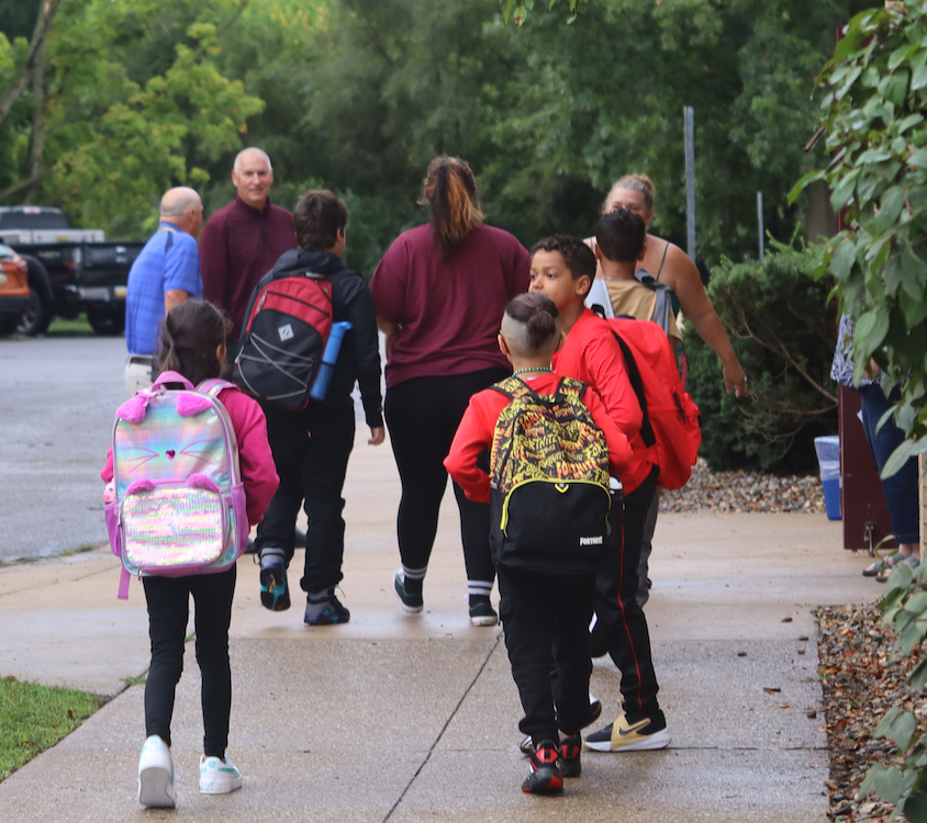 group of kids walking into school