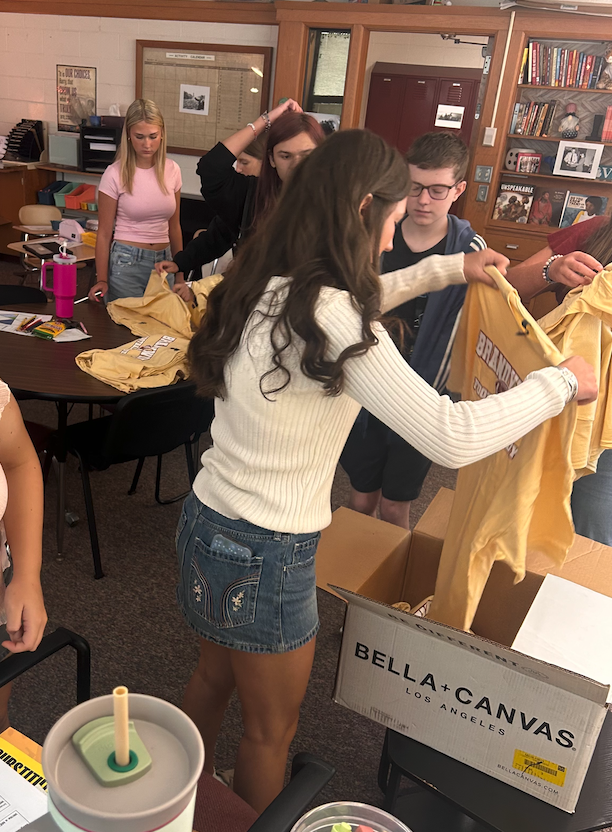 students organizing shirts