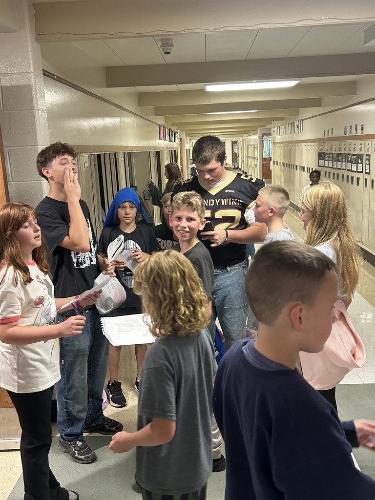 group of younger kids getting autographs