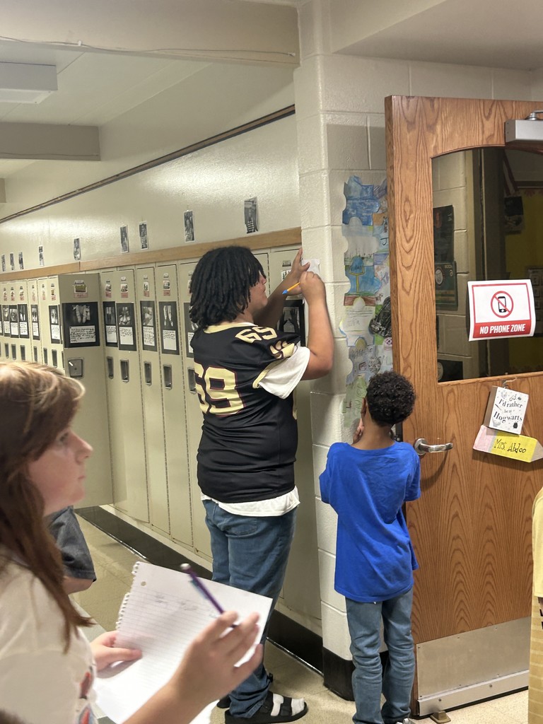 high schooler signing an autograph