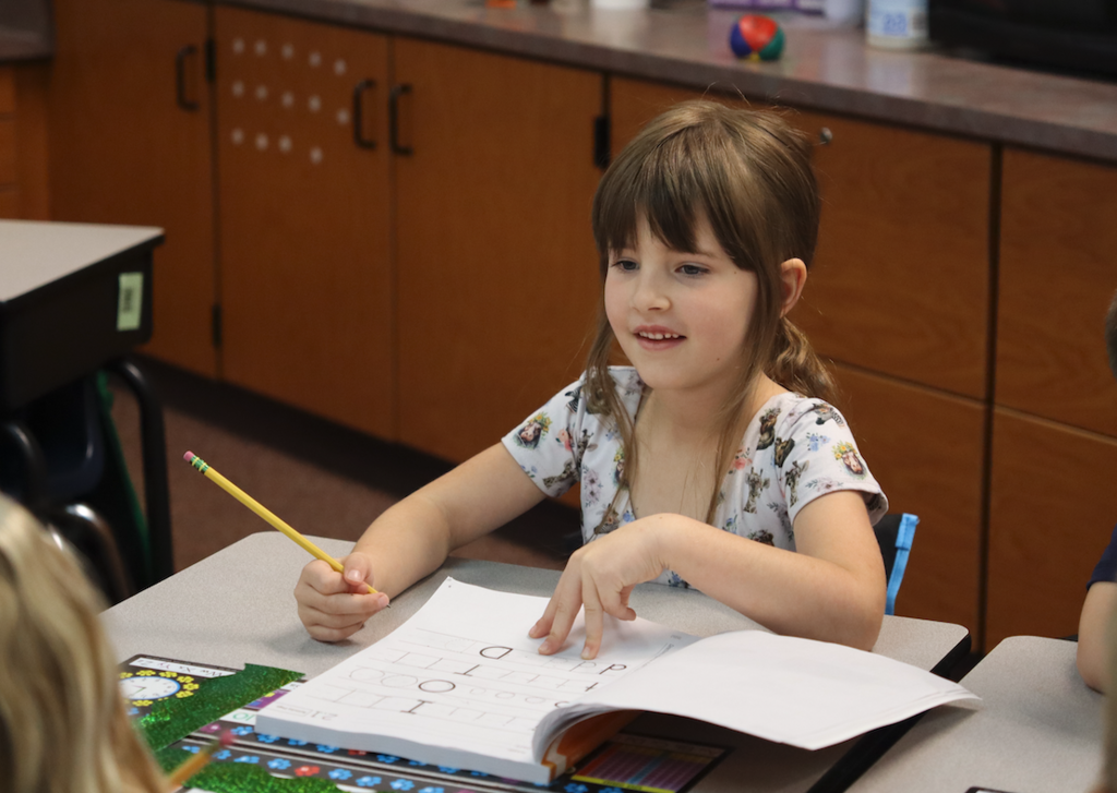 little girl practicing handwriting